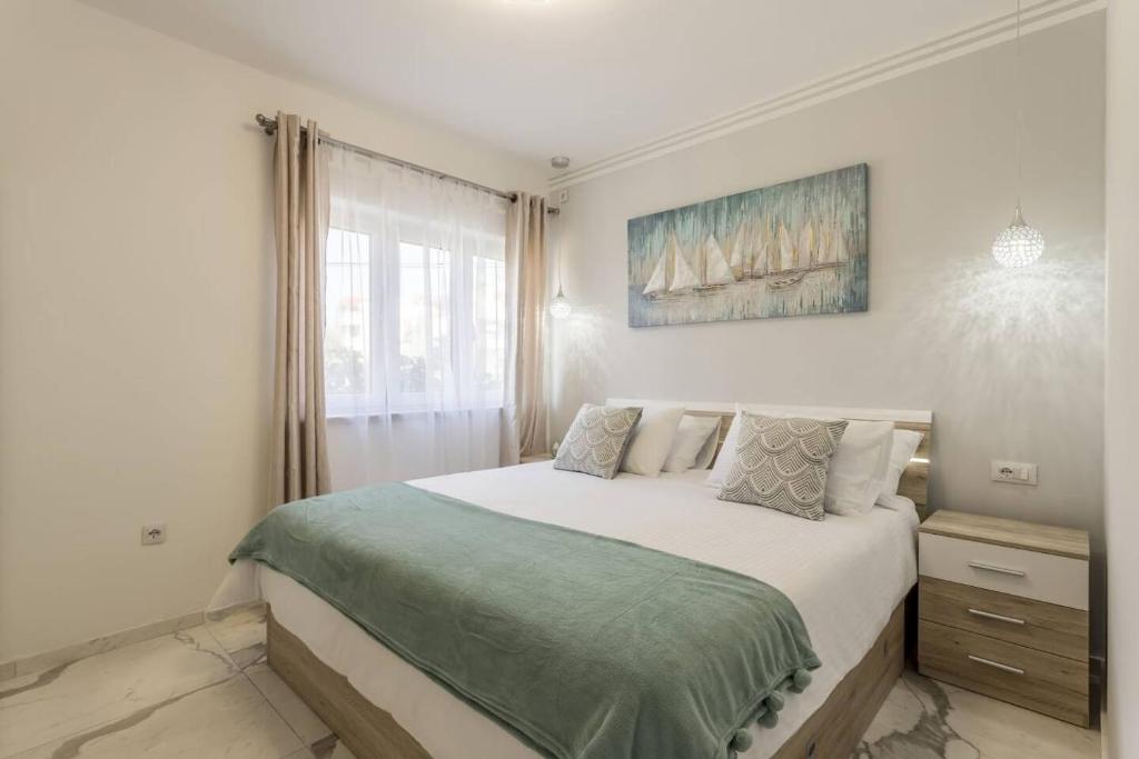 Postel nebo postele na pokoji v ubytování Royal Gold Apartment
