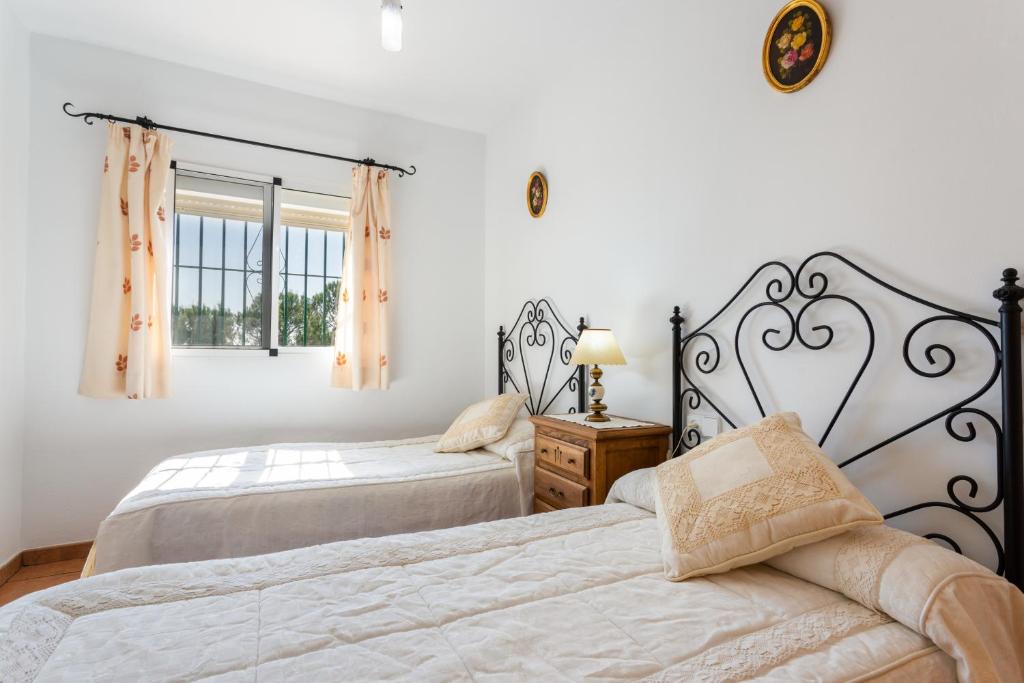 A bed or beds in a room at Cortijo Torrox Escape