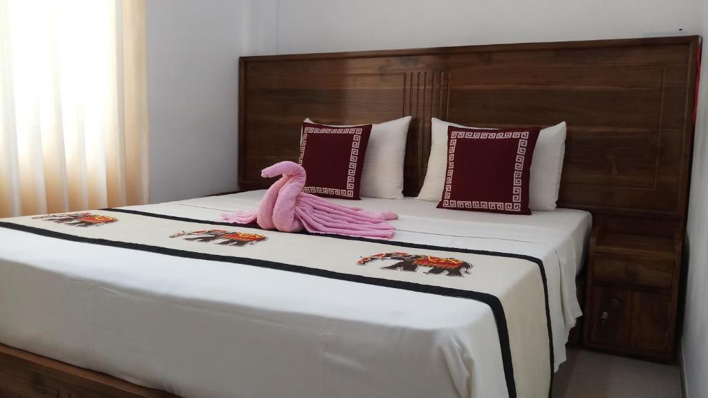 Postel nebo postele na pokoji v ubytování Shani Residence Kandy