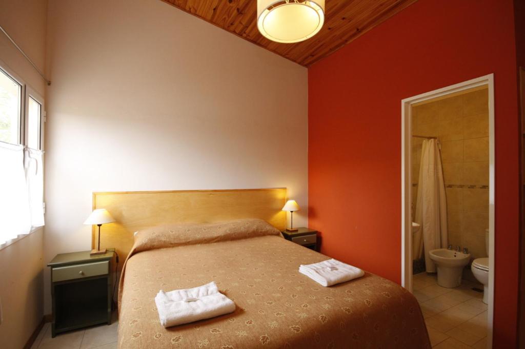 Postel nebo postele na pokoji v ubytování El Gualicho Hostel
