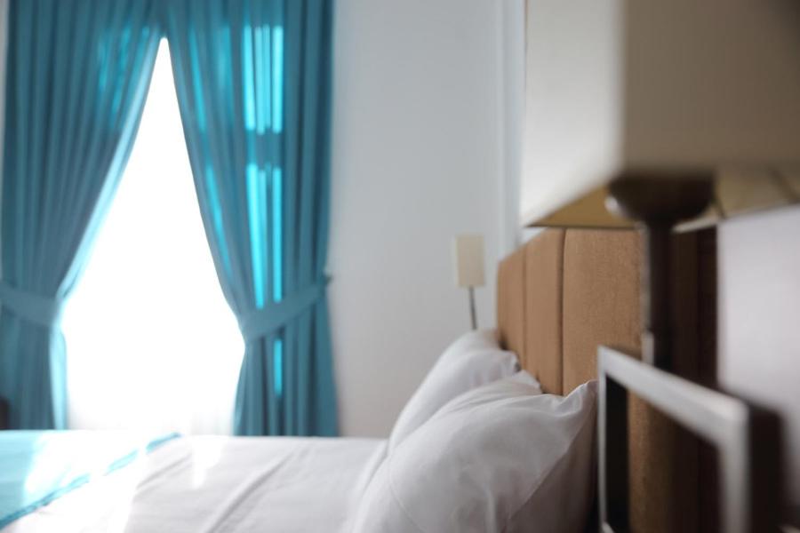 Postel nebo postele na pokoji v ubytování A&F Hotel Chemnitz