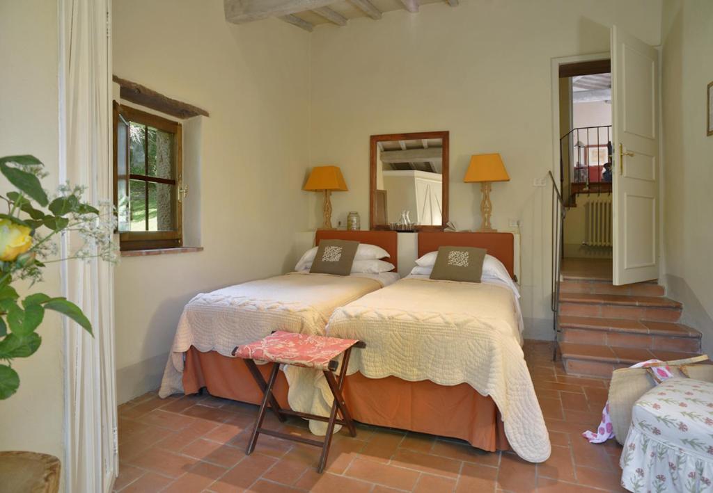 A bed or beds in a room at Casa Dell'Ambasciatore