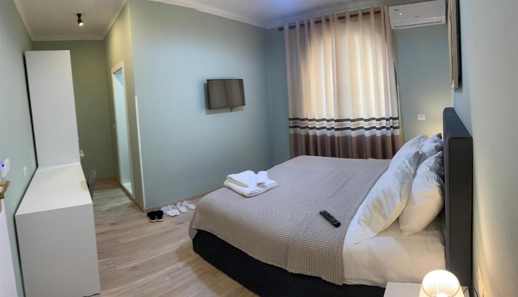 Postel nebo postele na pokoji v ubytování BELUX HOTEL