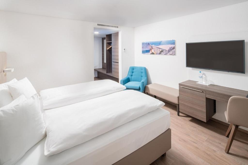 Postel nebo postele na pokoji v ubytování Hotel Al Ponte