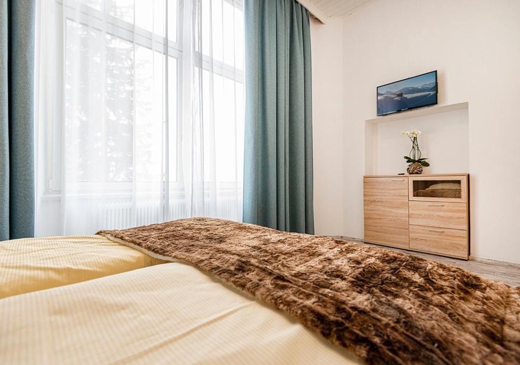 Postel nebo postele na pokoji v ubytování Hotel Bristol