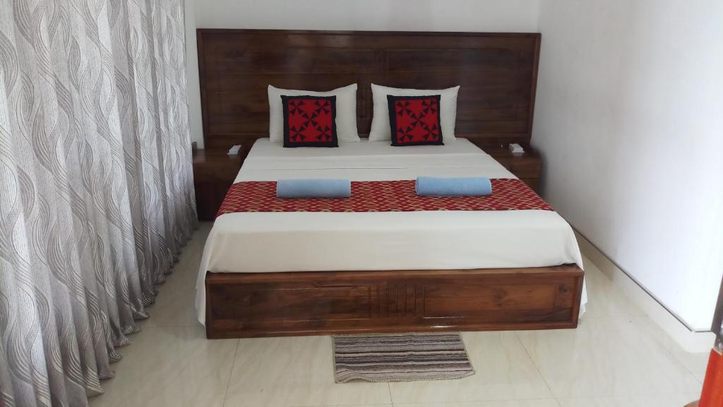 Postel nebo postele na pokoji v ubytování Shani Residence Kandy