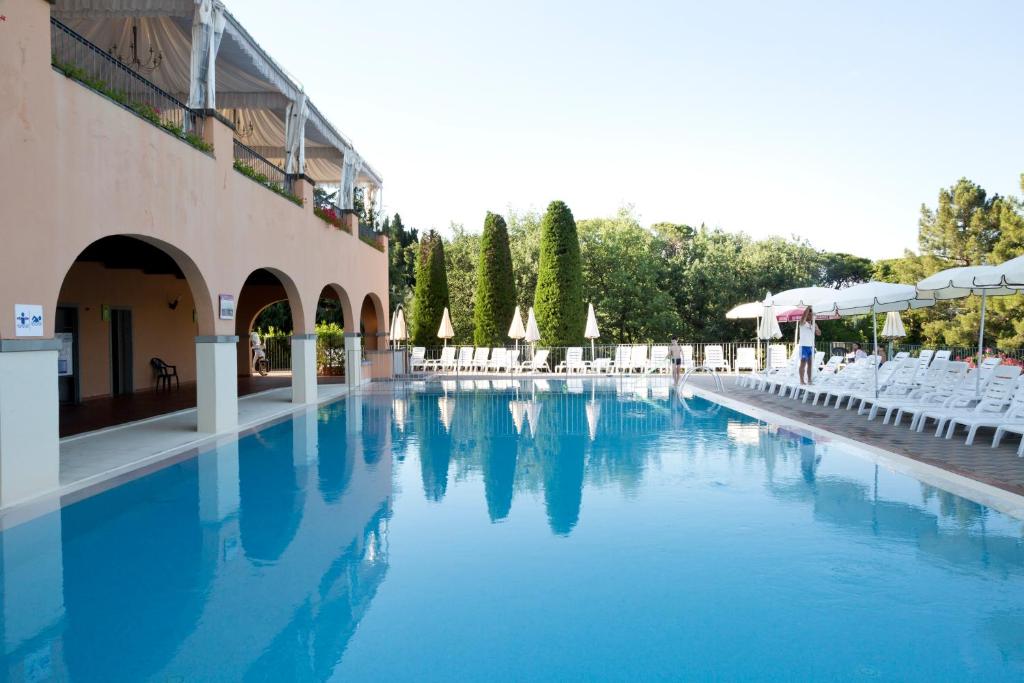 The swimming pool at or close to Villa Norcenni ApartHotel