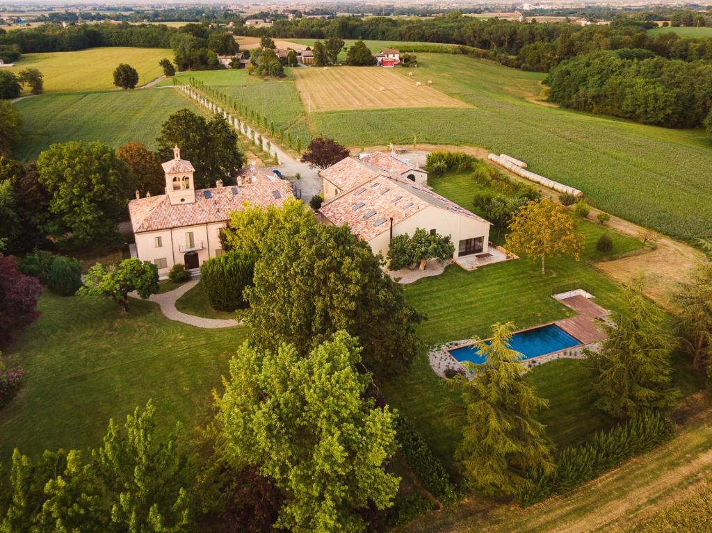 an aerial view of a large house with a swimming pool at Case Zucchi Bioagriturismo in Castelnuovo Fogliani
