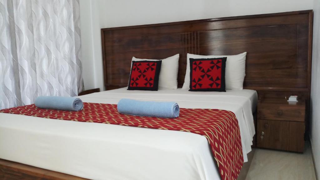 Postel nebo postele na pokoji v ubytování Shani Residence Kandy