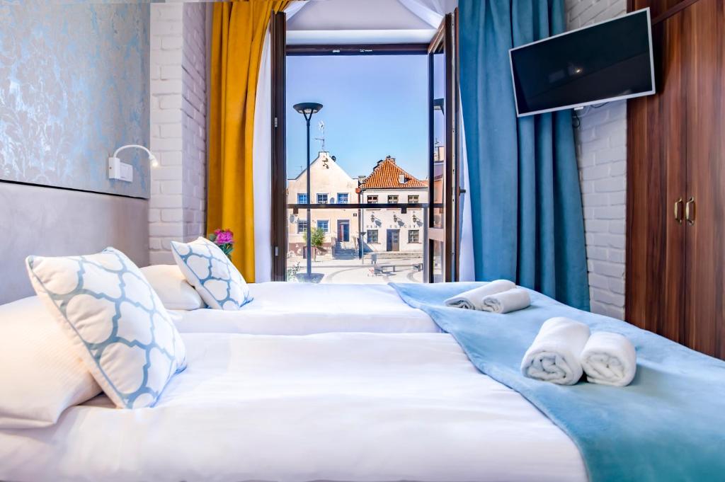 Postel nebo postele na pokoji v ubytování Pod Wzgórzem Bed & Breakfast