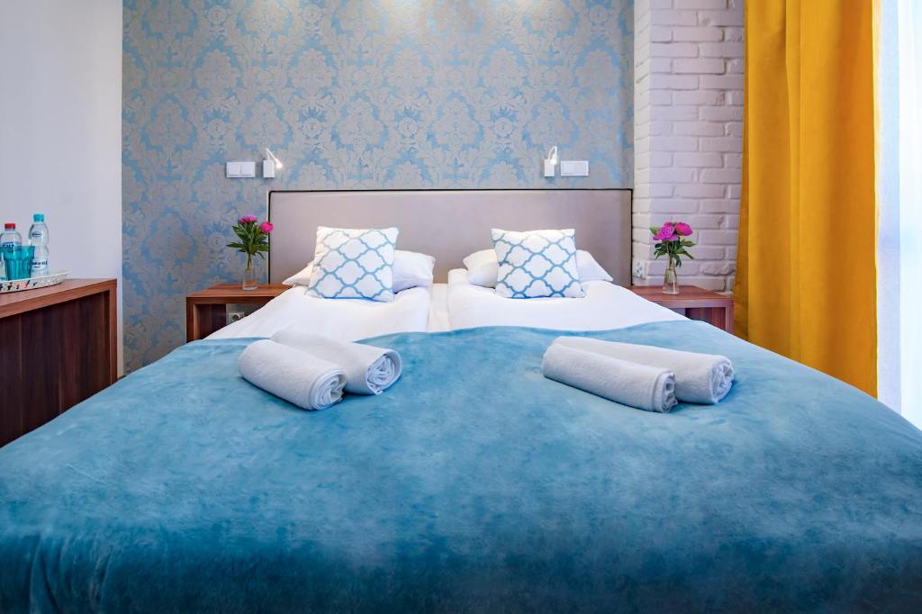 Postel nebo postele na pokoji v ubytování Pod Wzgórzem Bed & Breakfast