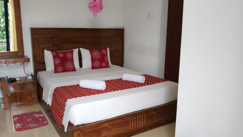 Postel nebo postele na pokoji v ubytování Shani Residence Kandy