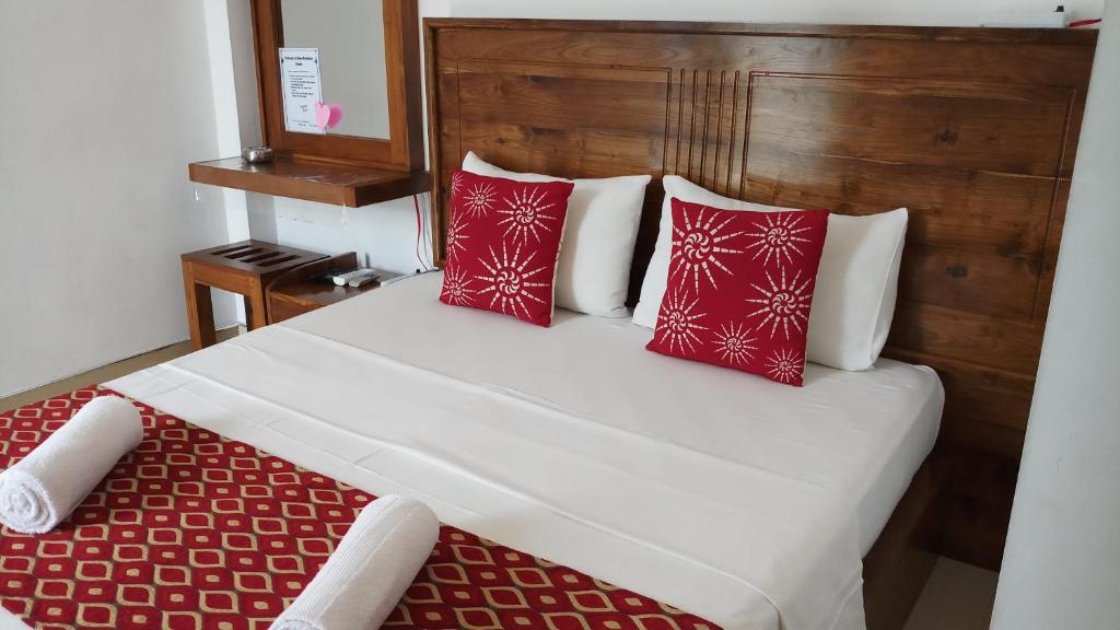 Postel nebo postele na pokoji v ubytování Shani Residence Kandy