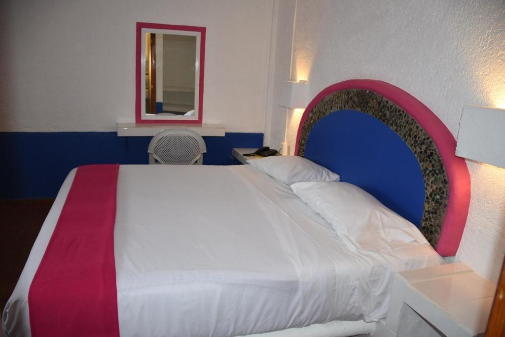 Postel nebo postele na pokoji v ubytování Hotel Pachuca Inn