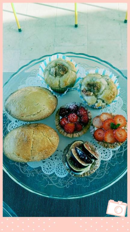a plate of pastries and bread on a table at FONTEblu B&B in Polignano a Mare