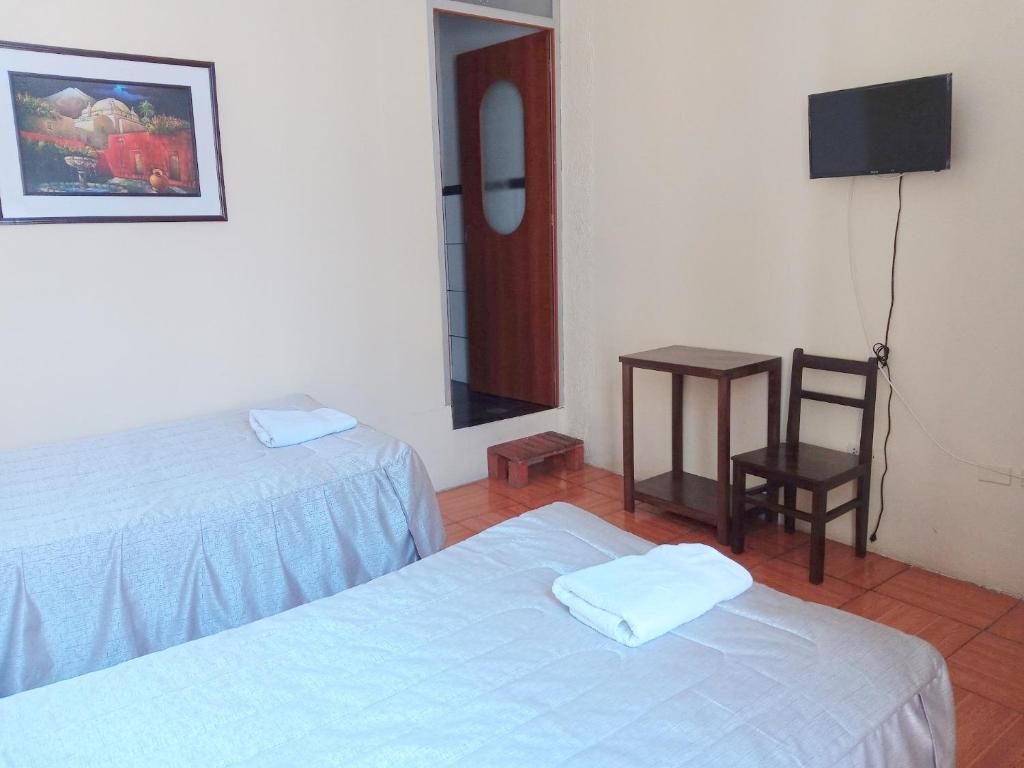 Postel nebo postele na pokoji v ubytování Mango Hostel B&B