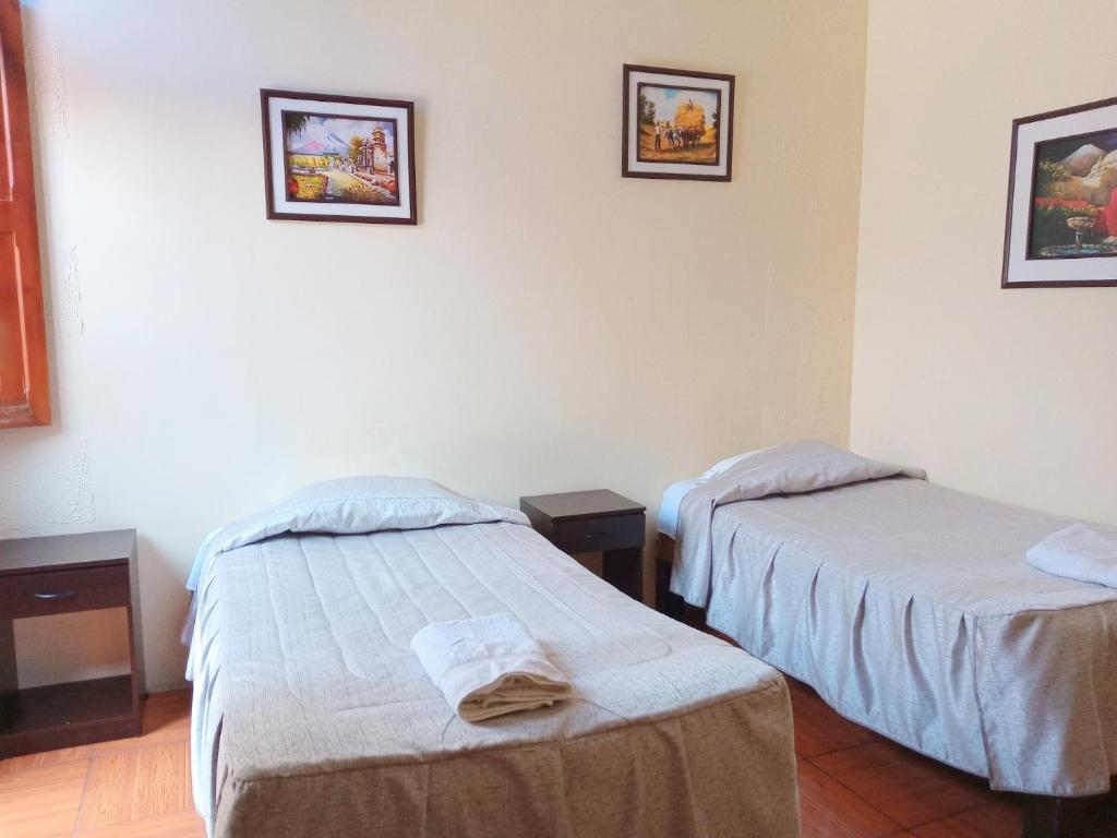 Postel nebo postele na pokoji v ubytování Mango Hostel B&B