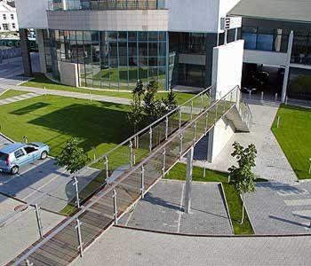 a metal staircase in front of a building with a car at Hotel Esprit in Bratislava