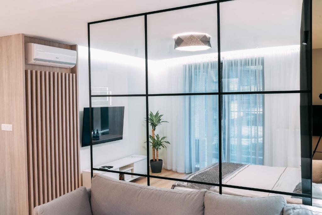 Televízia a/alebo spoločenská miestnosť v ubytovaní Vistula Terraces Apartment