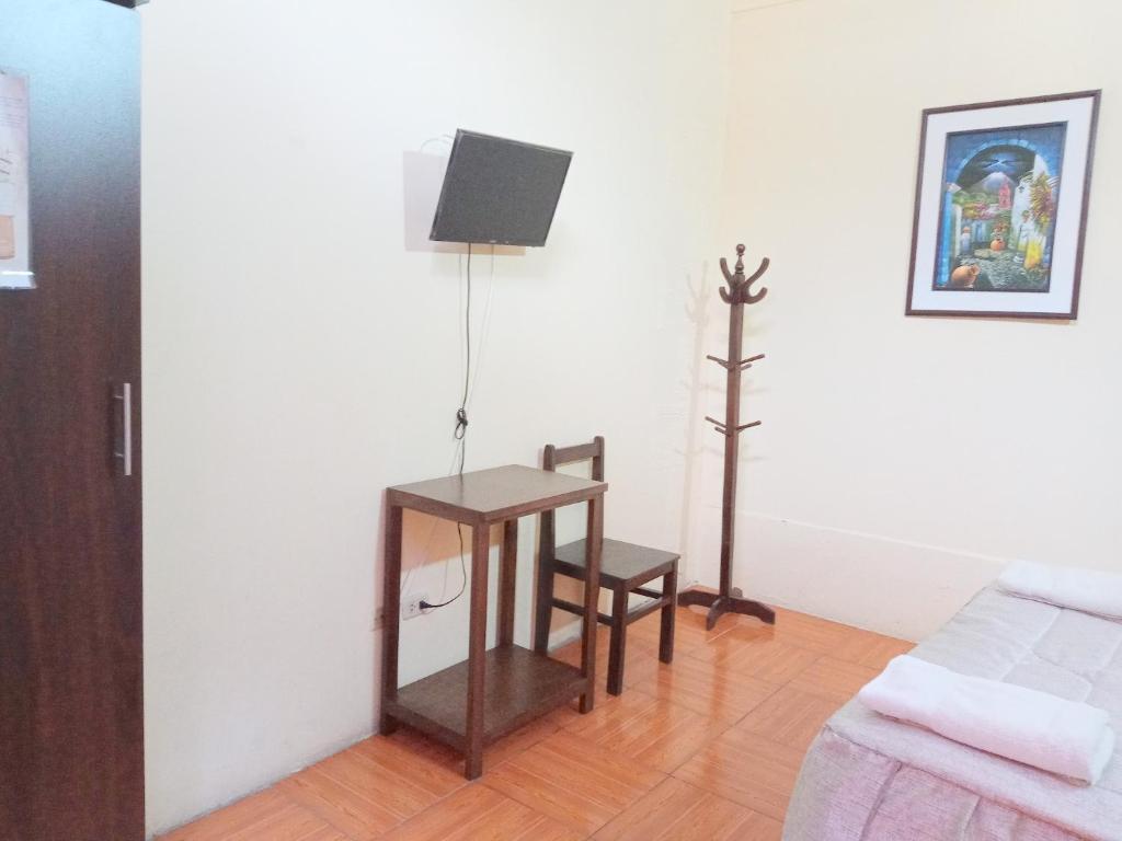 TV a/nebo společenská místnost v ubytování Mango Hostel B&B