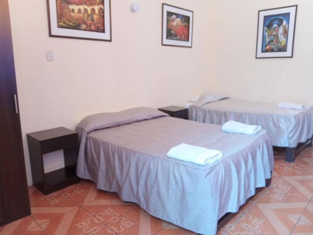 Postel nebo postele na pokoji v ubytování Mango Hostel B&B
