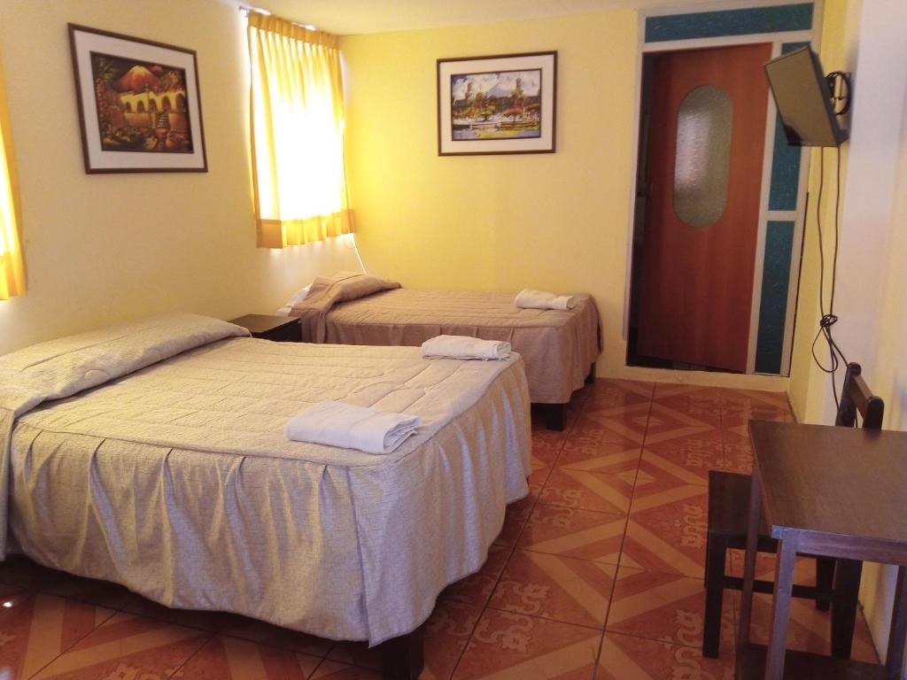 Postel nebo postele na pokoji v ubytování Mango Hostel B&B