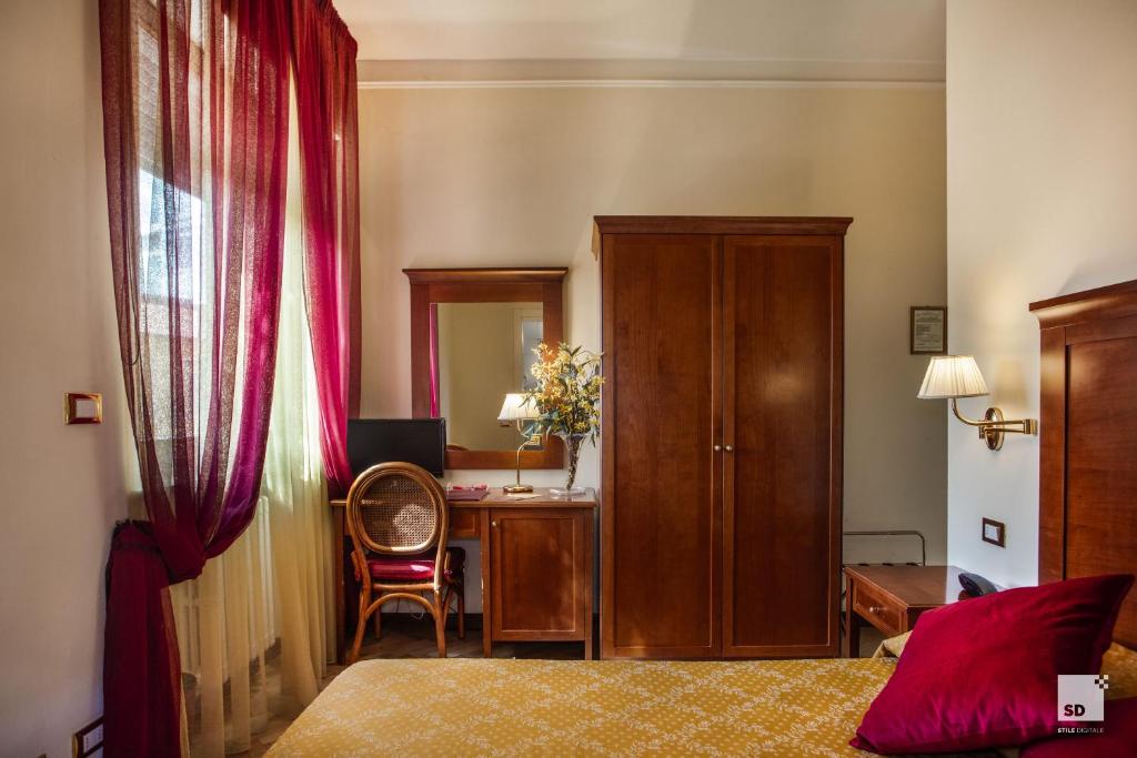 Postel nebo postele na pokoji v ubytování Hotel Alessandro Della Spina