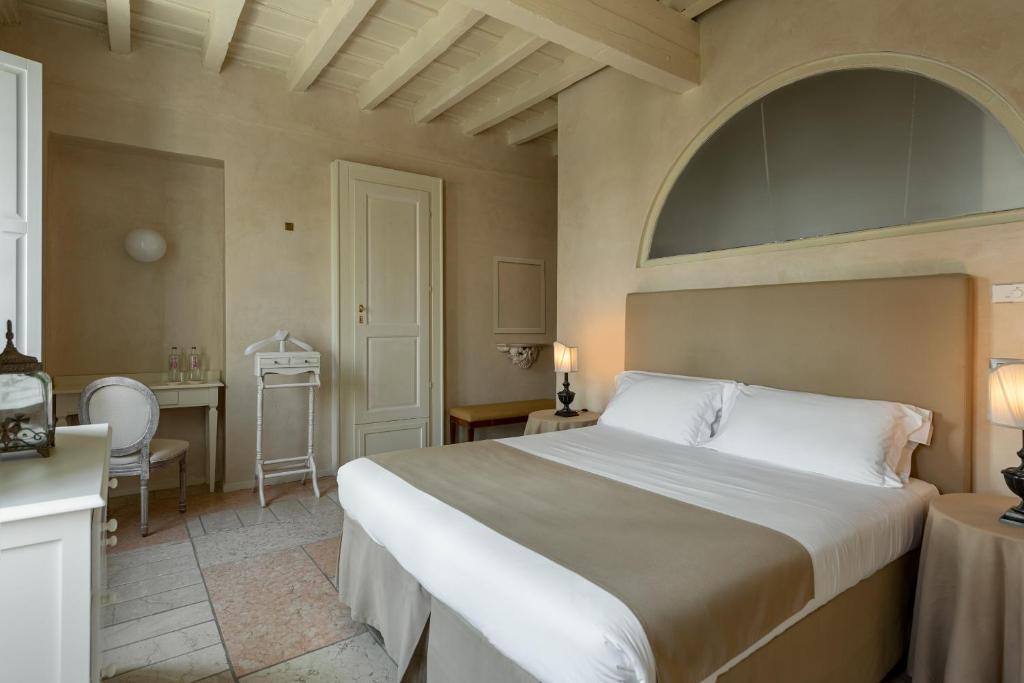Postel nebo postele na pokoji v ubytování Hotel Palazzo Novello