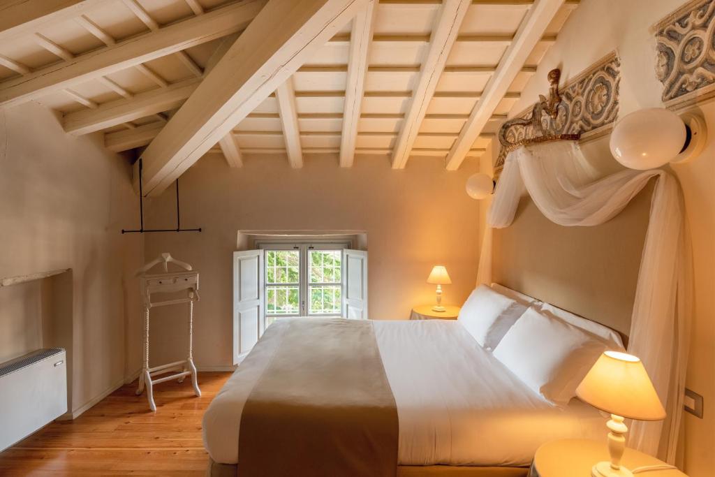 Postel nebo postele na pokoji v ubytování Hotel Palazzo Novello