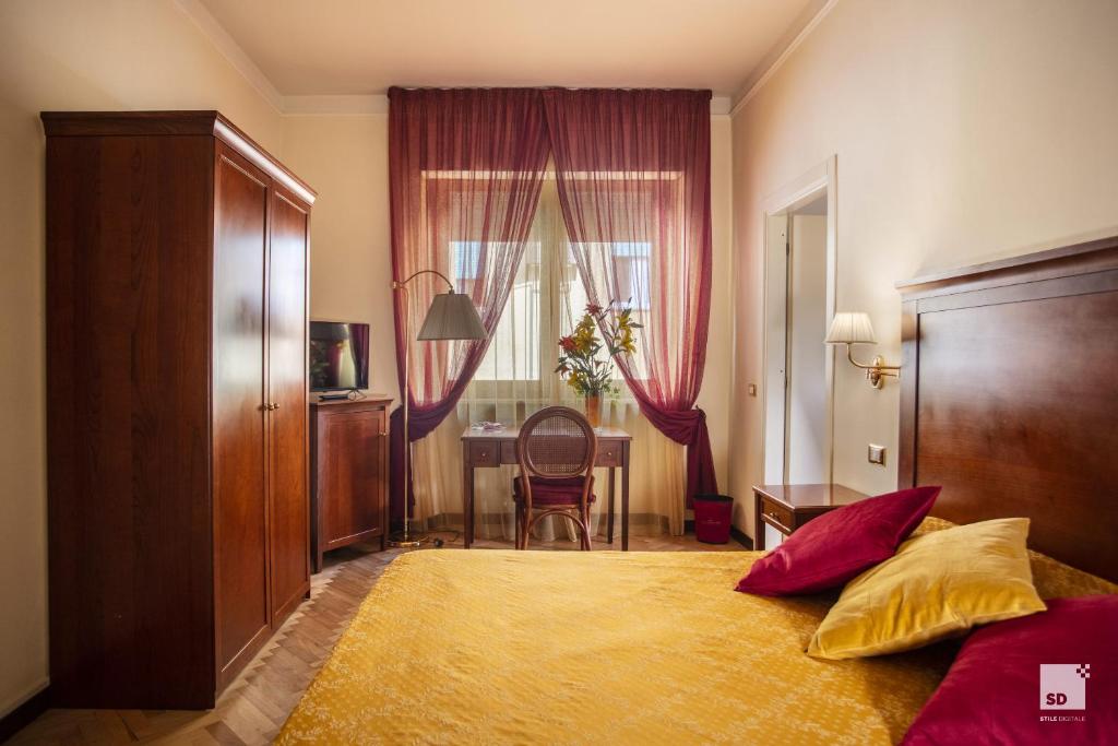 Postel nebo postele na pokoji v ubytování Hotel Alessandro Della Spina
