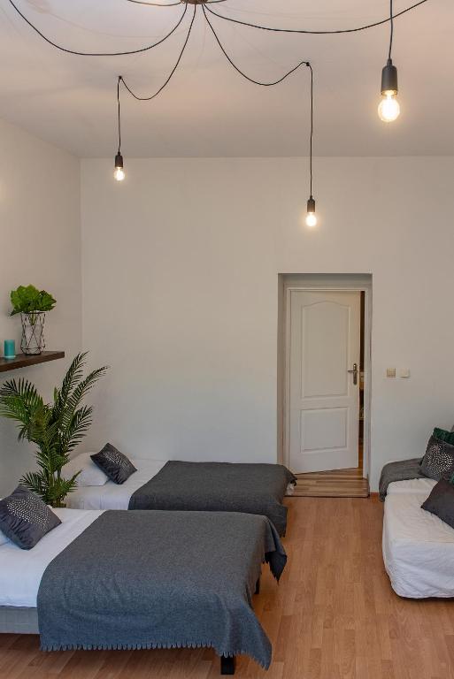 Posteľ alebo postele v izbe v ubytovaní 3D Wawel Apartament