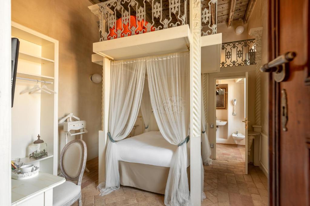 Postel nebo postele na pokoji v ubytování Hotel Palazzo Novello