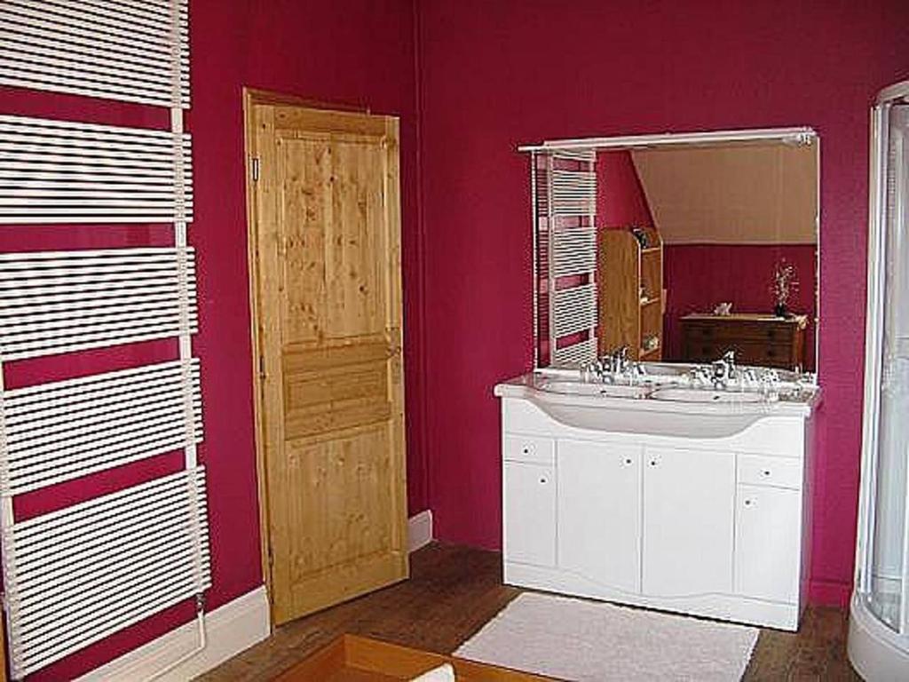 a bathroom with a sink and a mirror at La Chambre d'hôte de Christelle in Cherbourg en Cotentin