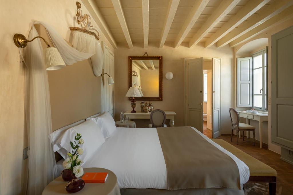 Postel nebo postele na pokoji v ubytování Hotel Palazzo Novello