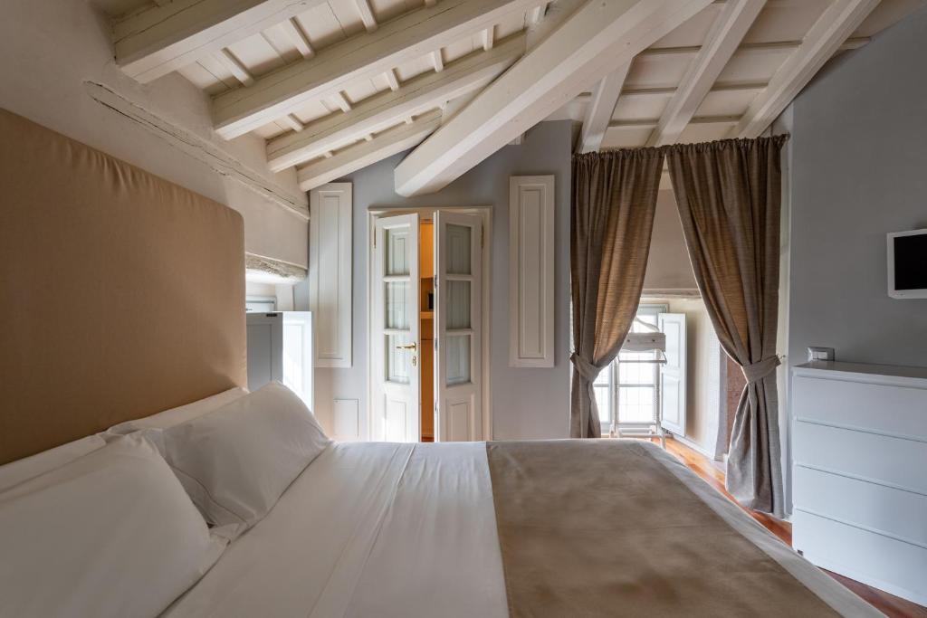 Postel nebo postele na pokoji v ubytování Hotel Palazzo Novello