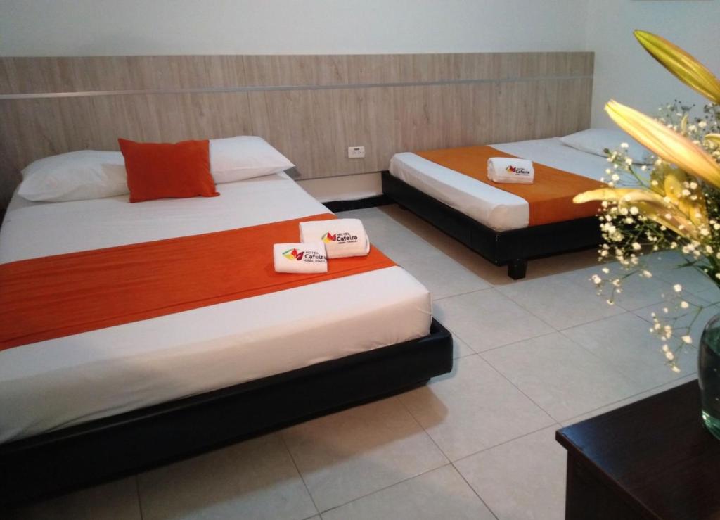 Postel nebo postele na pokoji v ubytování Hotel Cafeira