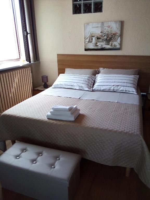 Postel nebo postele na pokoji v ubytování Agriturismo Ai Prüsot