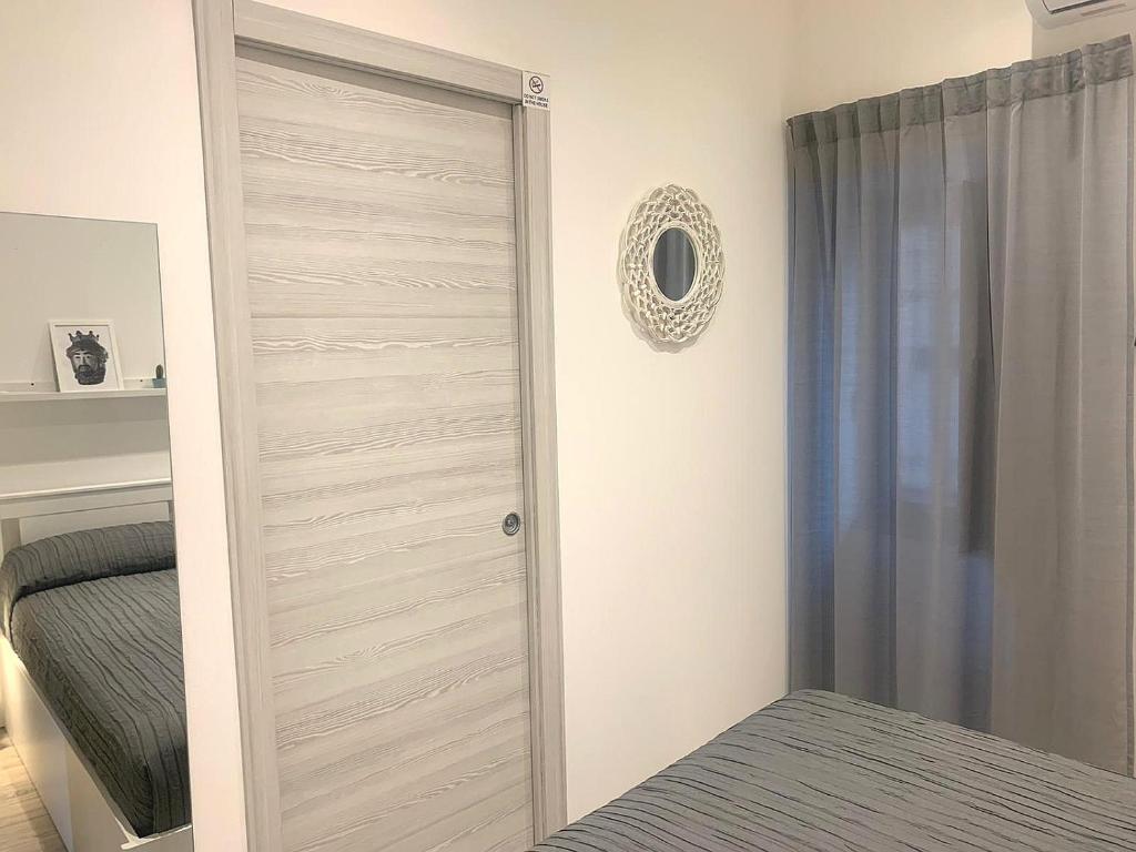 Łóżko lub łóżka w pokoju w obiekcie CATANIA CENTRAL DELUXE HOUSE