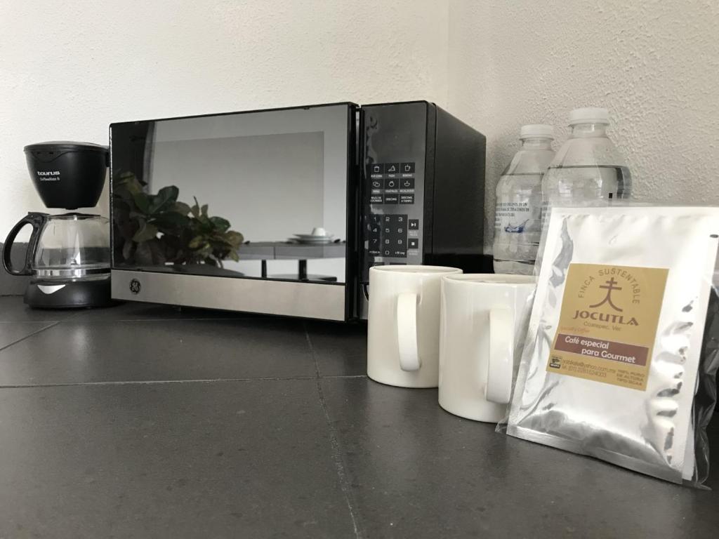 Příslušenství pro přípravu čaje a kávy v ubytování Hotel Ros Gaud