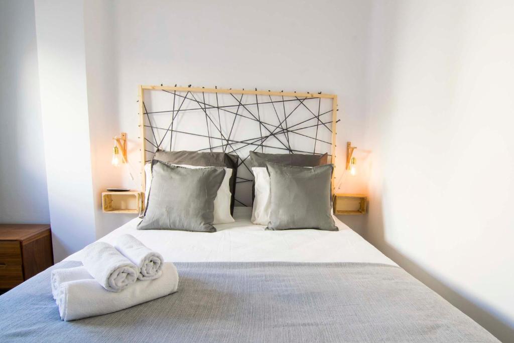 Posteľ alebo postele v izbe v ubytovaní P&P Apartaments Arapiles