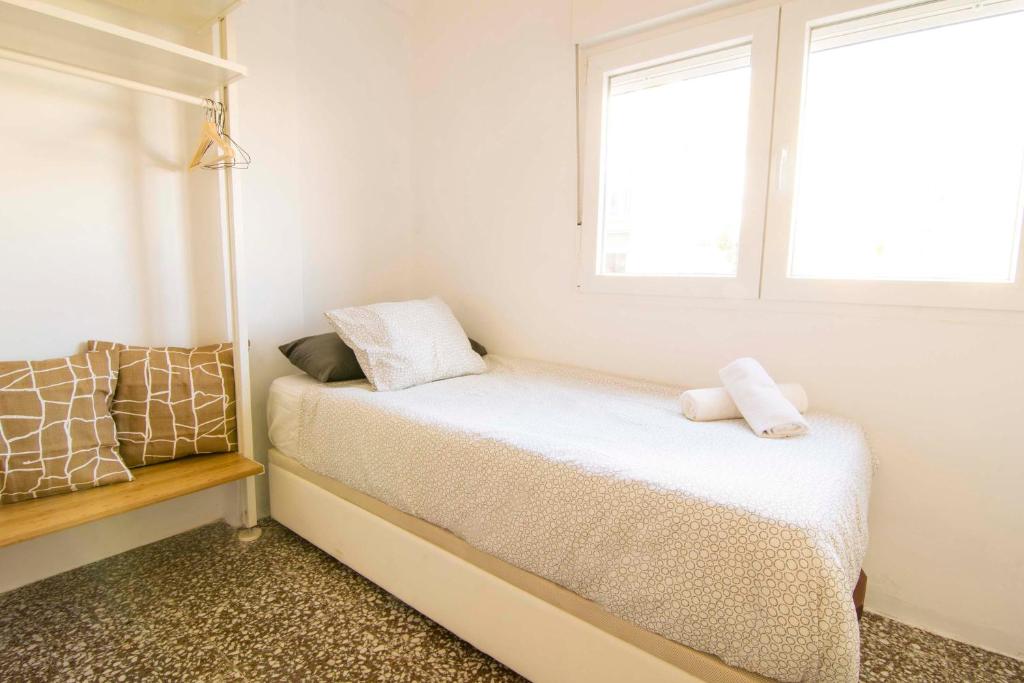 Posteľ alebo postele v izbe v ubytovaní P&P Apartaments Arapiles