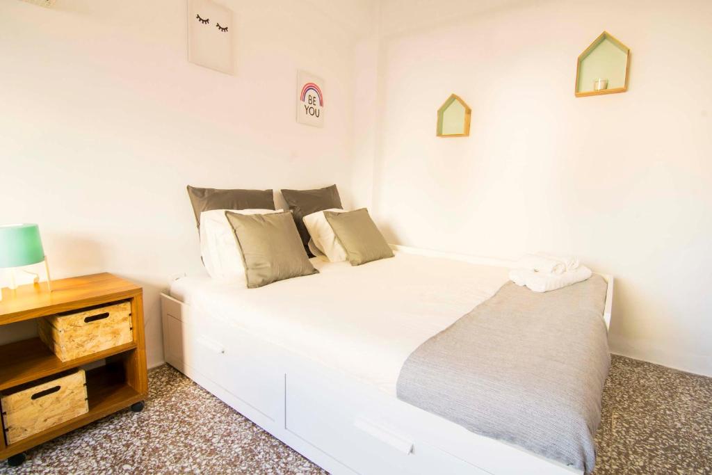 Posteľ alebo postele v izbe v ubytovaní P&P Apartaments Arapiles