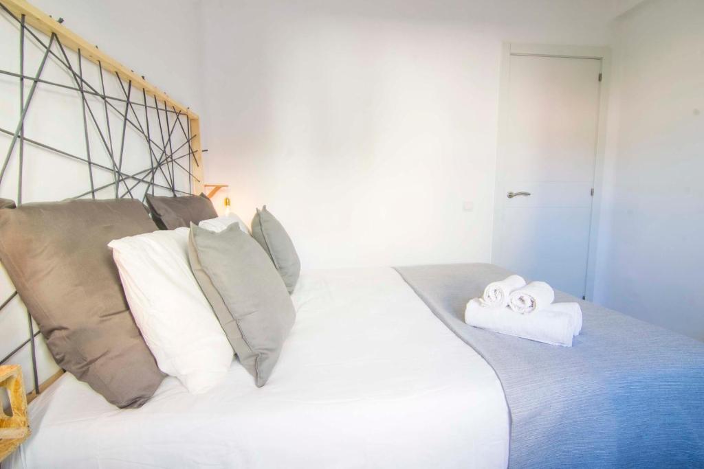 Posteľ alebo postele v izbe v ubytovaní P&P Apartaments Arapiles