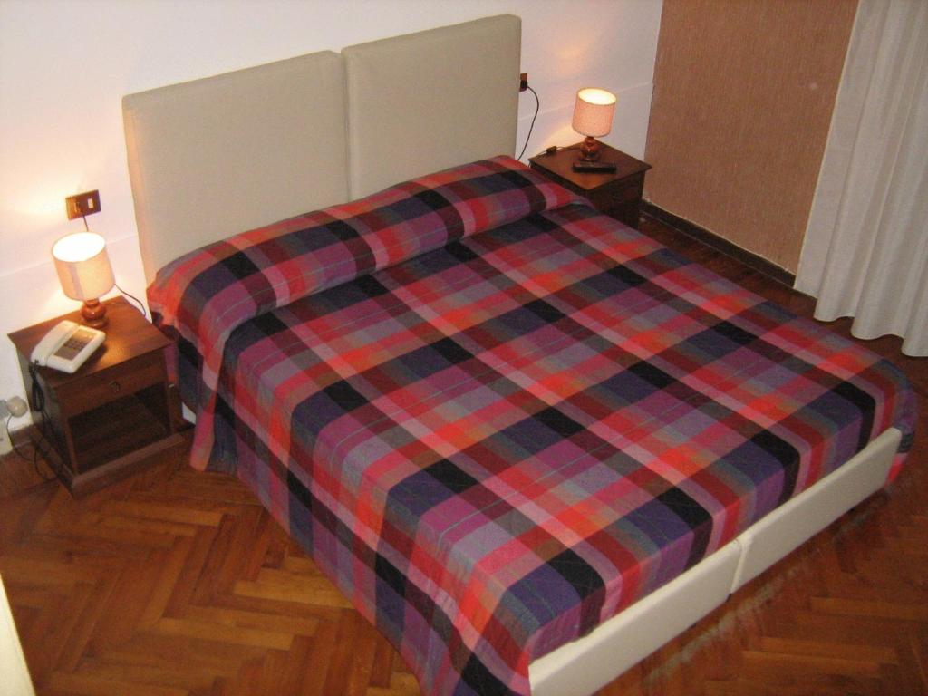 Postel nebo postele na pokoji v ubytování Hotel Da Cesare