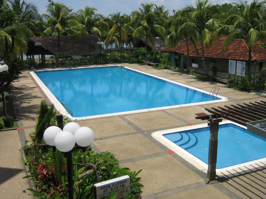 an overhead view of a swimming pool at a resort at Seri Bulan Condo in Port Dickson