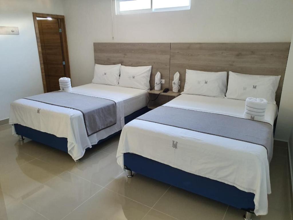 Cama o camas de una habitación en HOTEL A1 EXPRESS