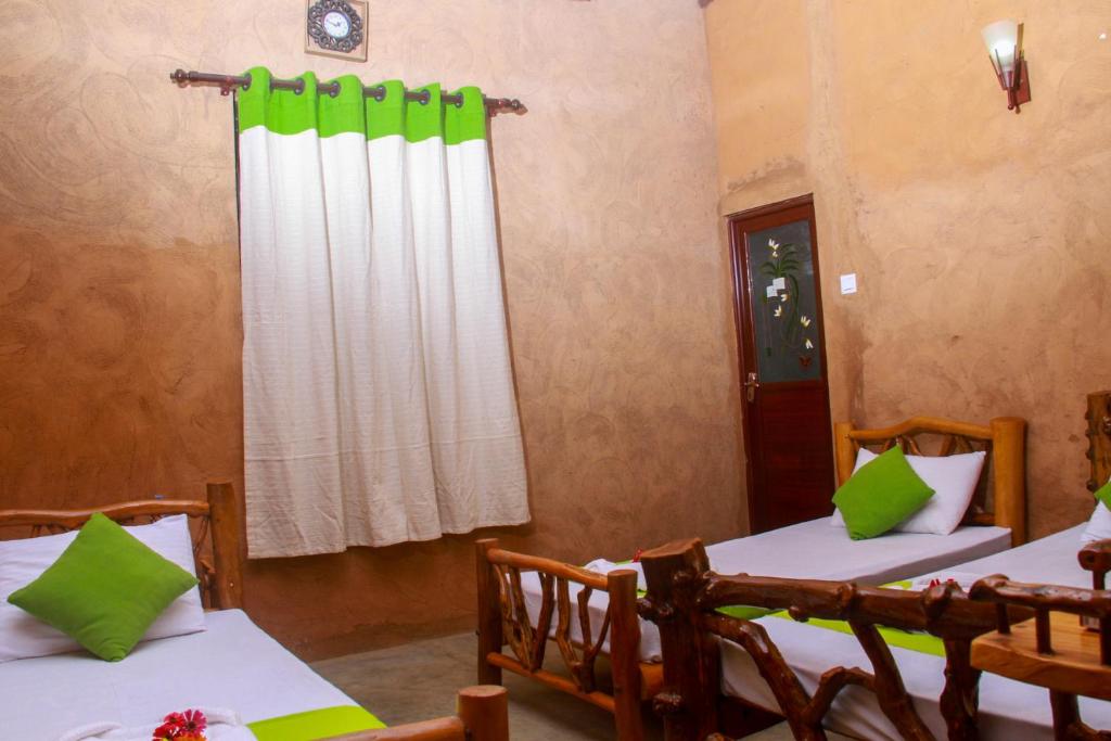 Postel nebo postele na pokoji v ubytování YalaWay Nature Villa