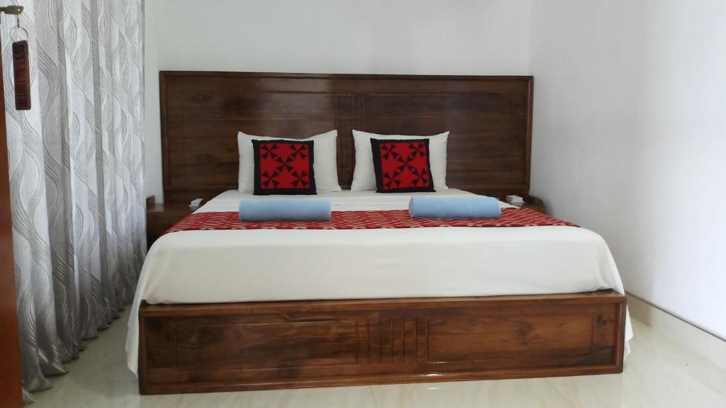 Postel nebo postele na pokoji v ubytování Shani Residence Kandy