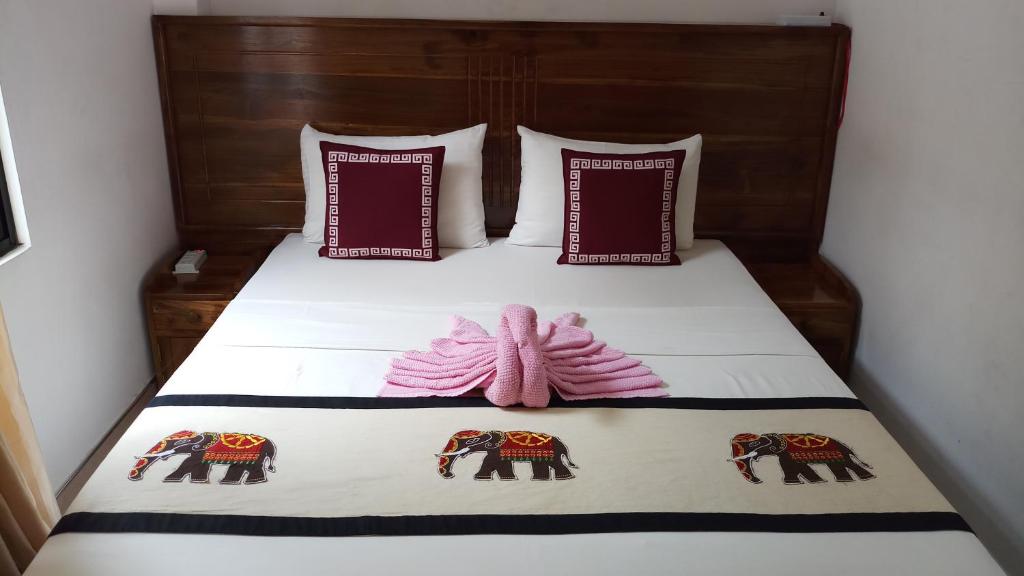 Postel nebo postele na pokoji v ubytování Shani Residence Kandy