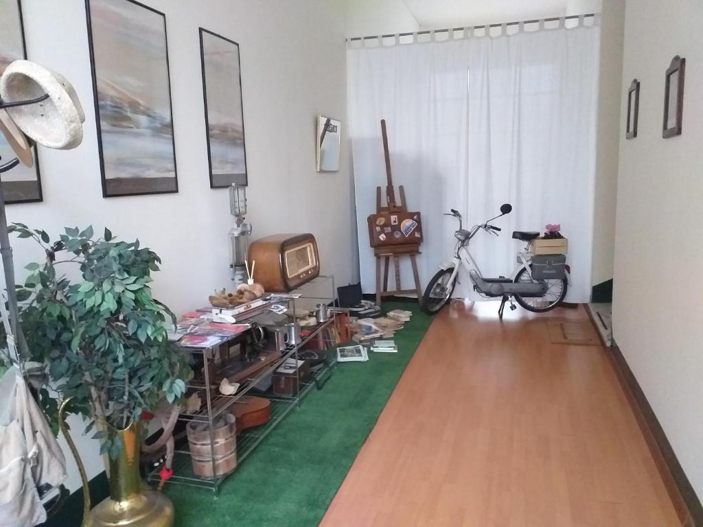 a living room with a table and a tv in it at B&Bvintage5bis in Turin